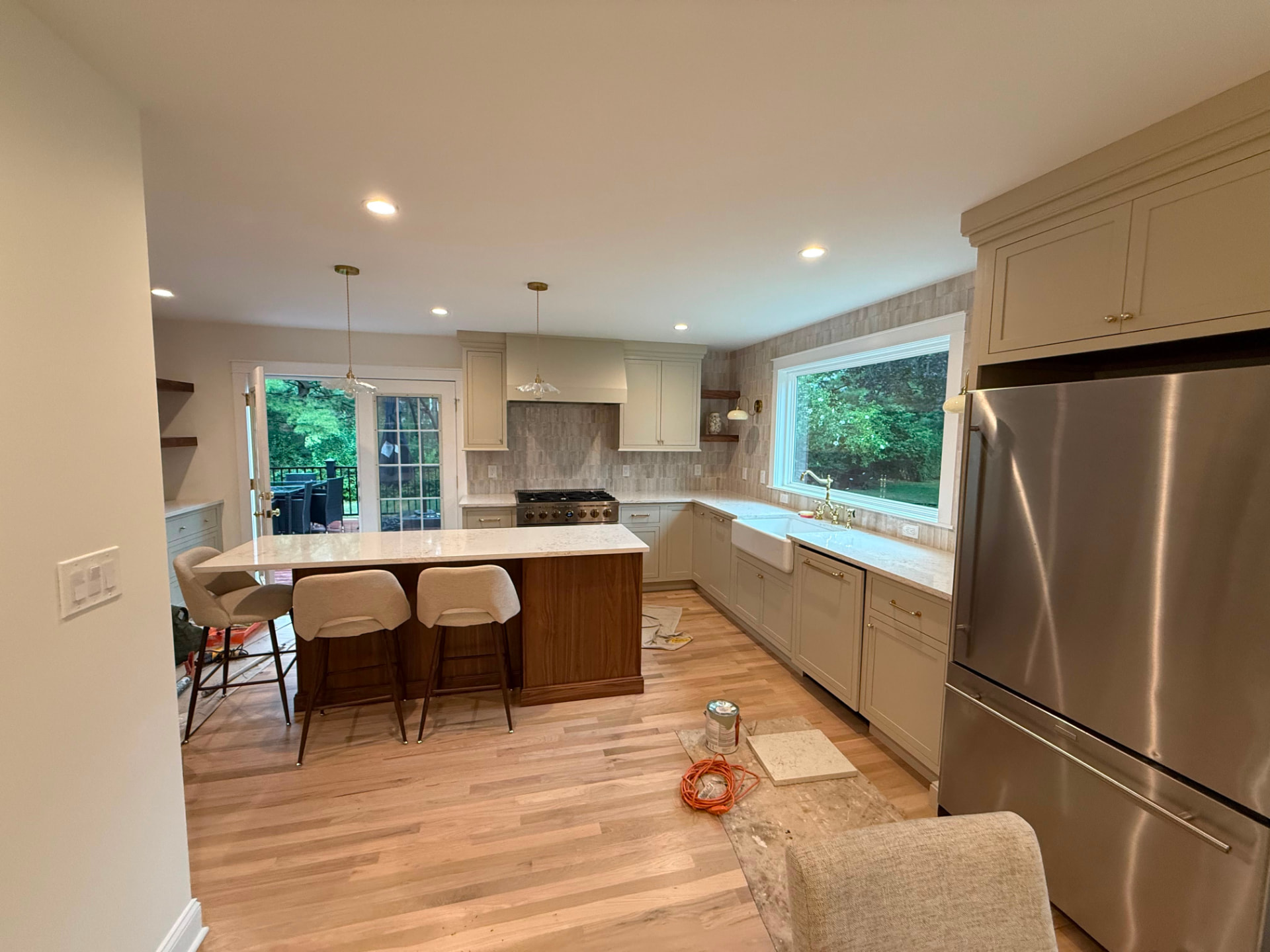 Kitchen with walnut island, French doors and painted walls