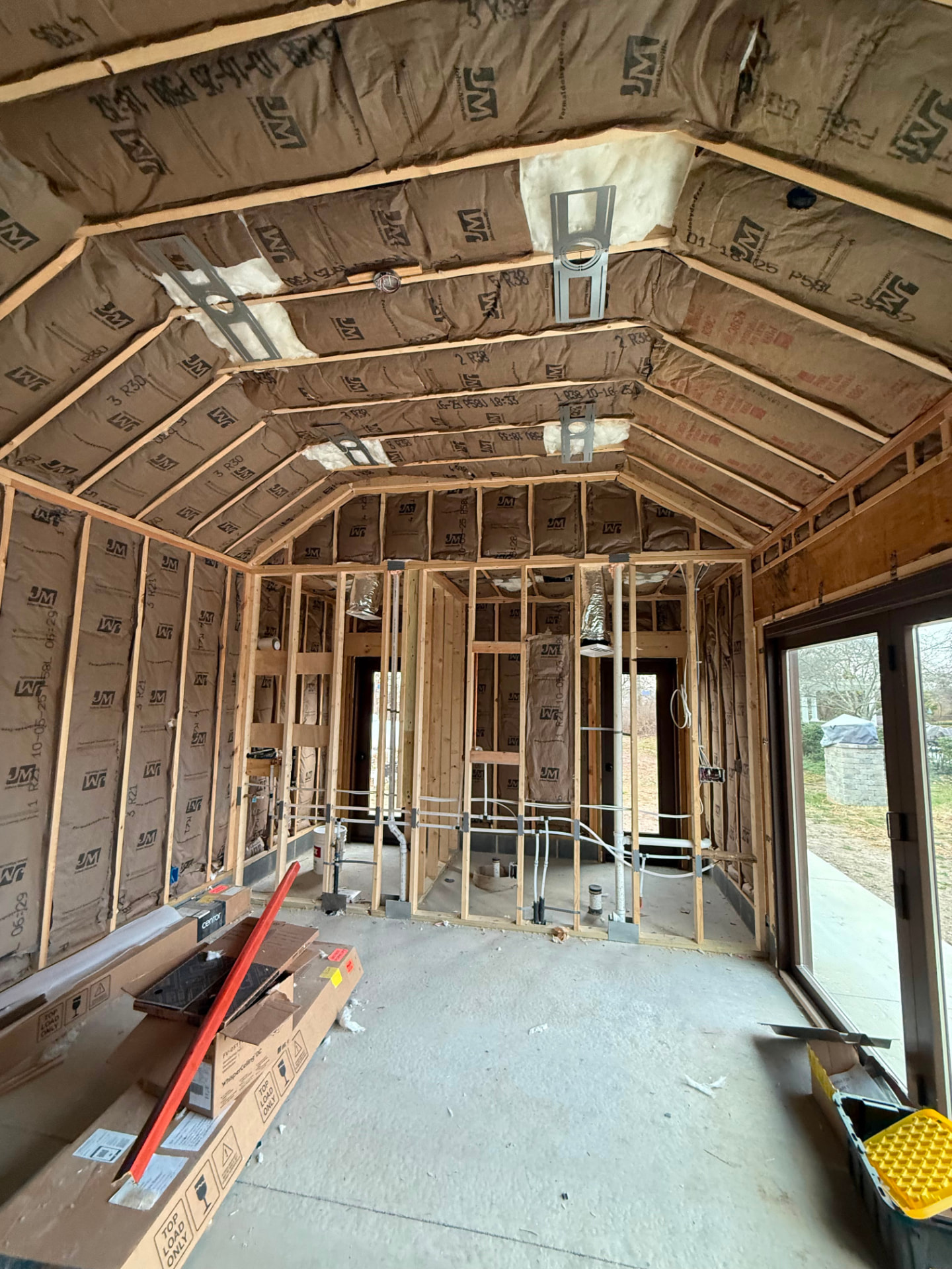 Pool house framed with plumbing roughed in before insulation