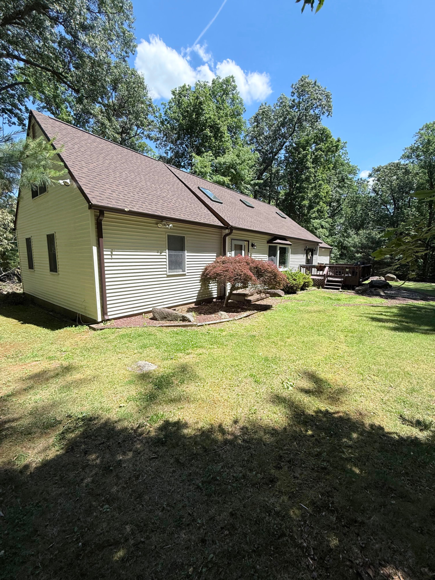 Side view of the Cape Cod home before the new porch was built